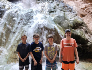 Kids at a waterfall in the Grand Canyon.