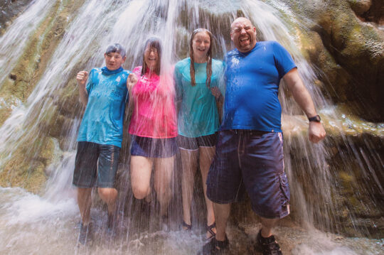 Family in a waterfall