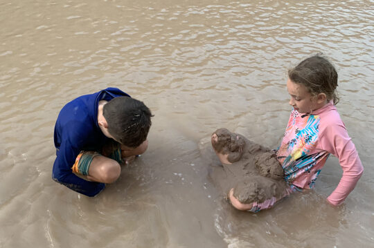 Two children playing in the water on the Colorado River