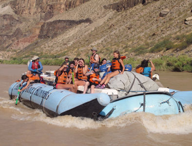 Kids and families on motor boat in Grand Canyon