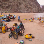 Overview of a rafting camp with people in wheelchairs