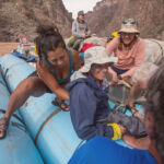 Paraplegic woman smiling while on a raft